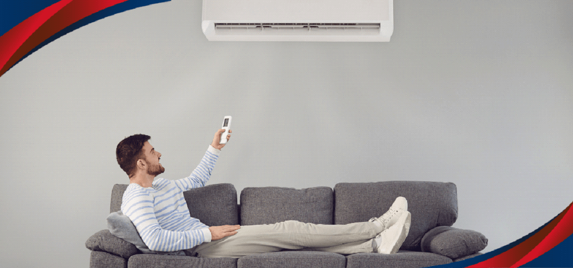 Man Holding Remote Of Split Type Air Conditioner